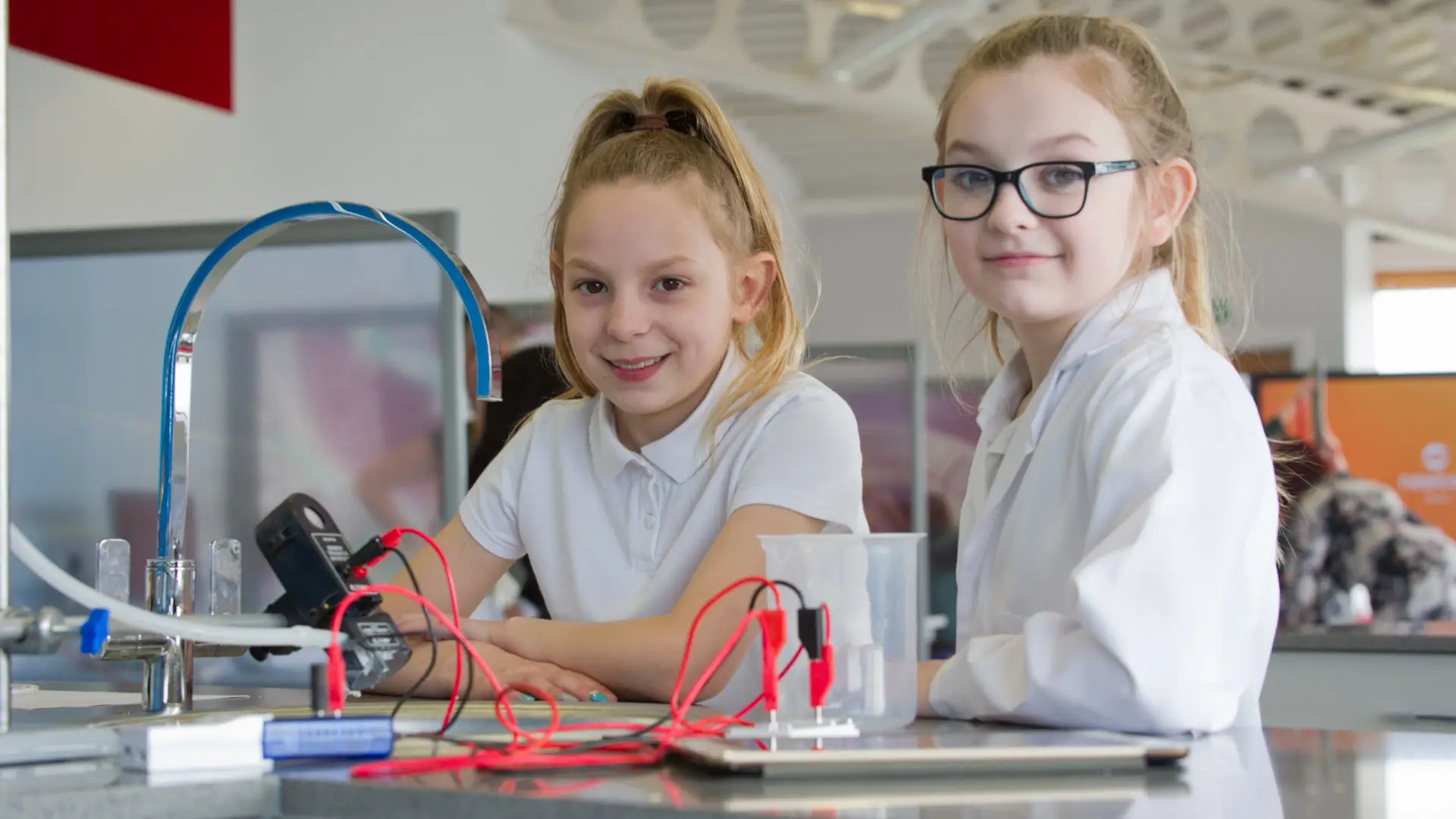 Two primary children carrying out an experiment with the Science Skills Academy