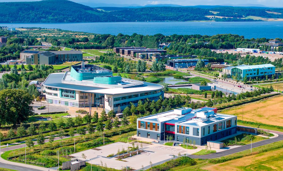 Inverness Campus from above featuring the UHI Inverness College building and looking out to the Inner Moray Firth featuring the Kessock bridge. 