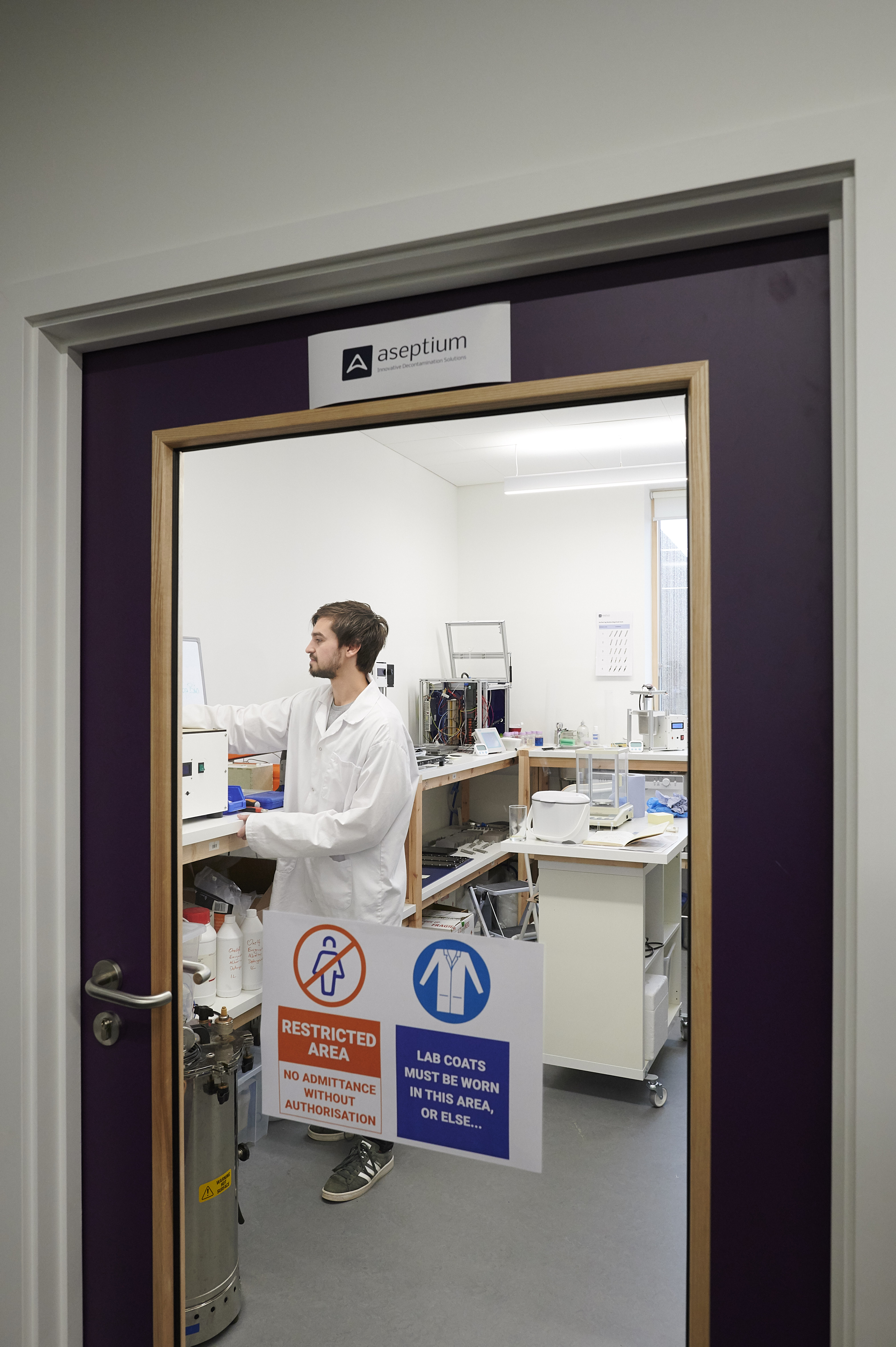 Looking through glass door to Aseptium lab in Aurora House, Inverness Campus