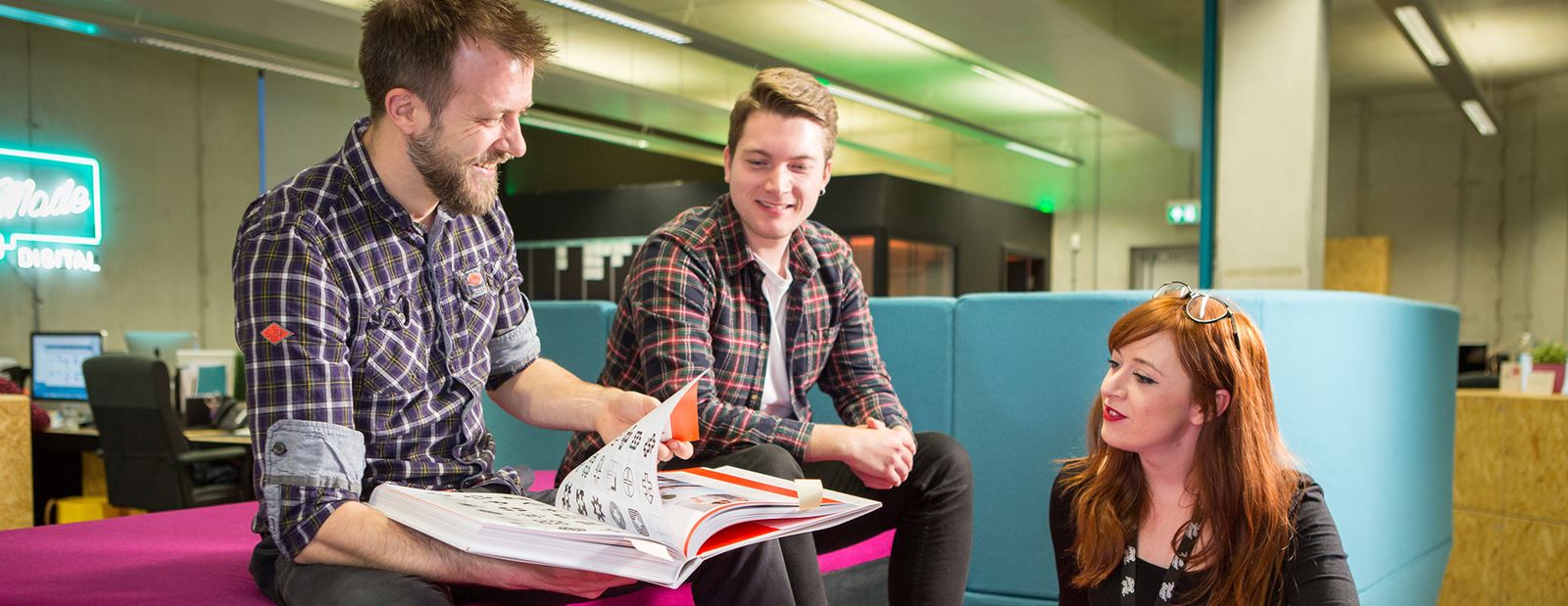 People working in an office reviewing documents 