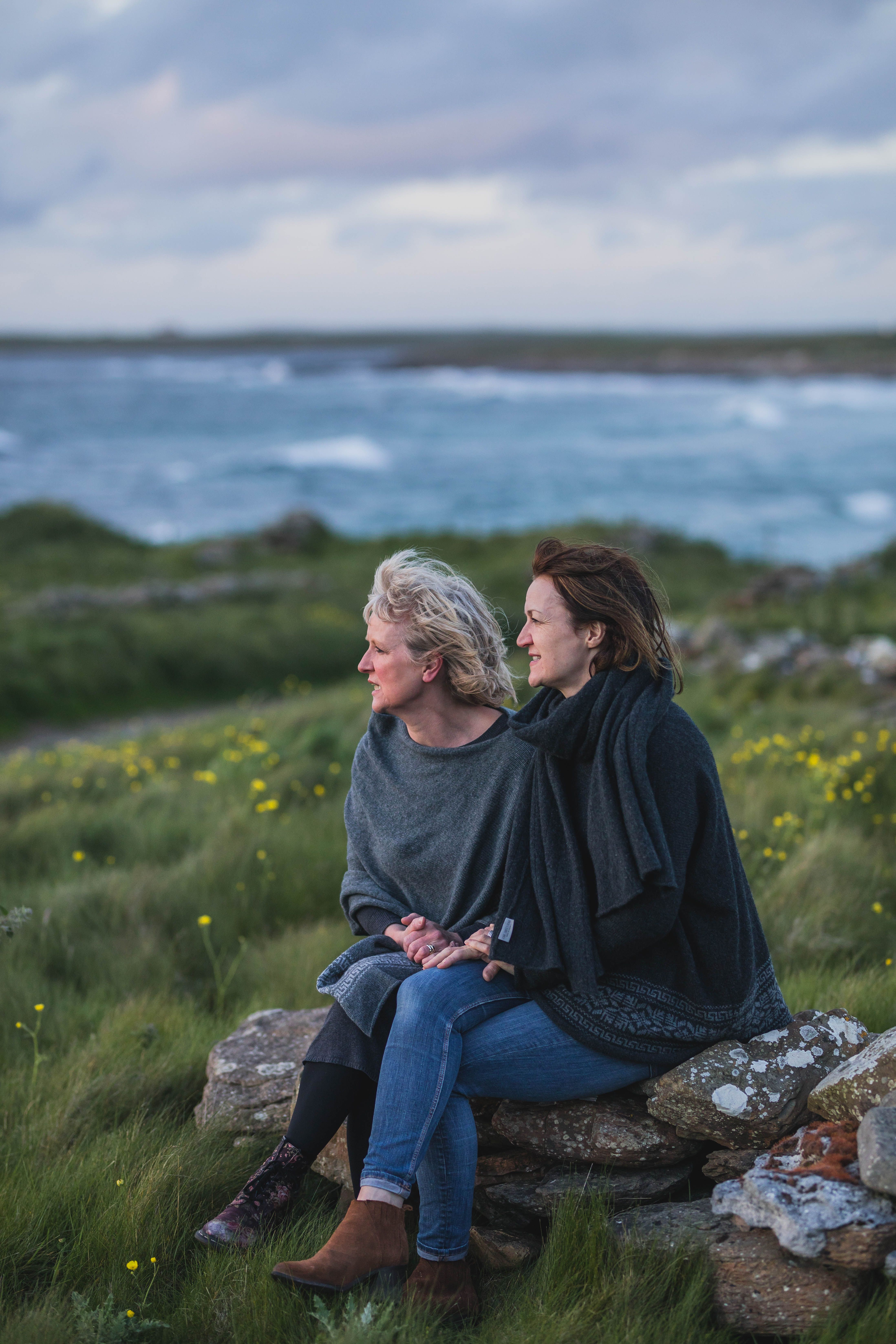 Two women outdoors wearing Hume Sweet Hume knitwear