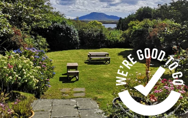 garden view to sea and hills from Langass Lodge hotel in Uist